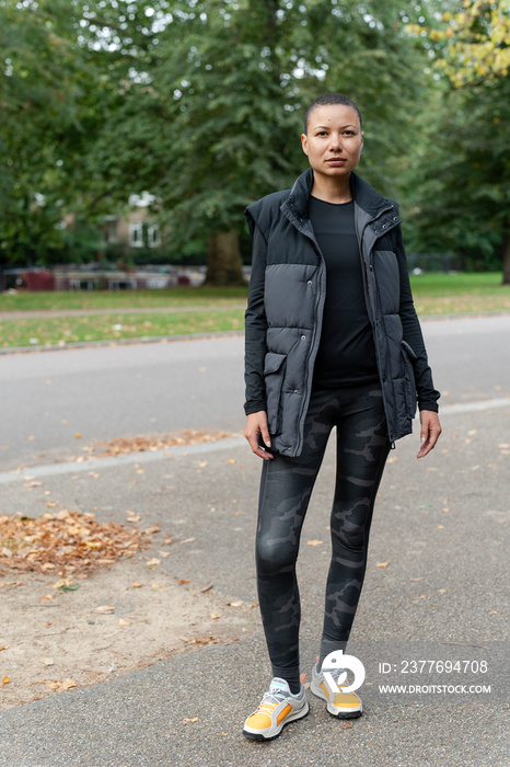 Portrait of woman in sports clothing in park