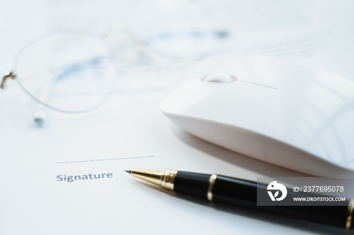 Business contract concept. Closeup of pen pointing to signature in contract paper form.
