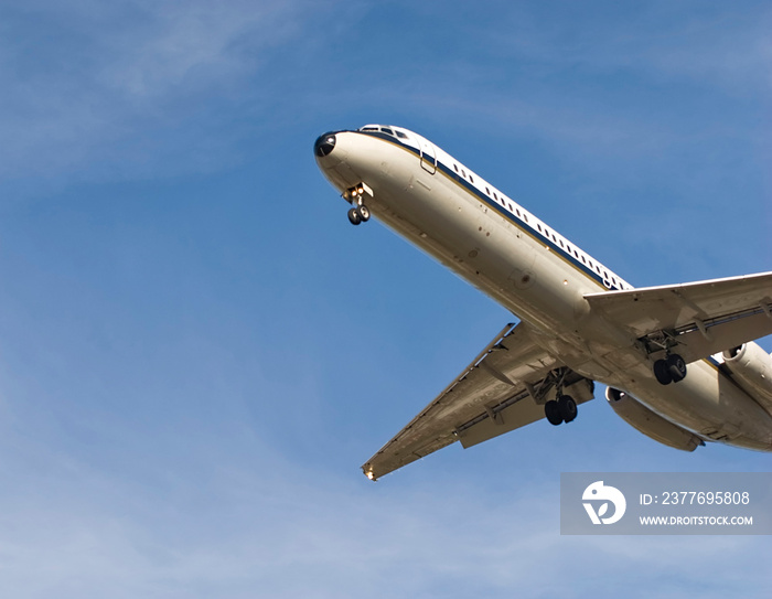 airplane flying in the blue sky, prepares for landing