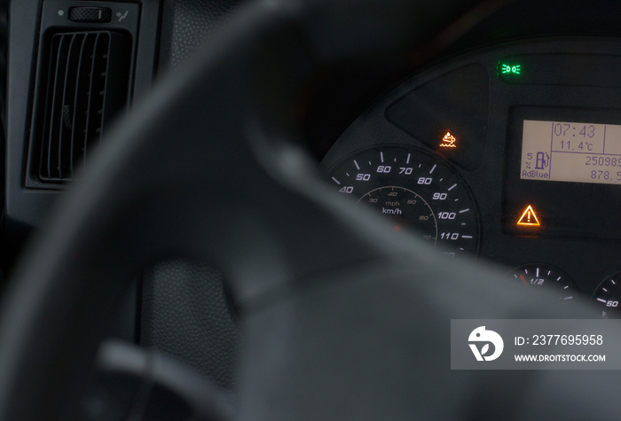 Lit AdBlue icon on truck´s dashboard. Diesel particulate filter issue due to low AdBlue level