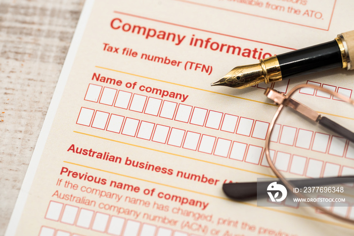 Australian tax declaration and pen on wooden table