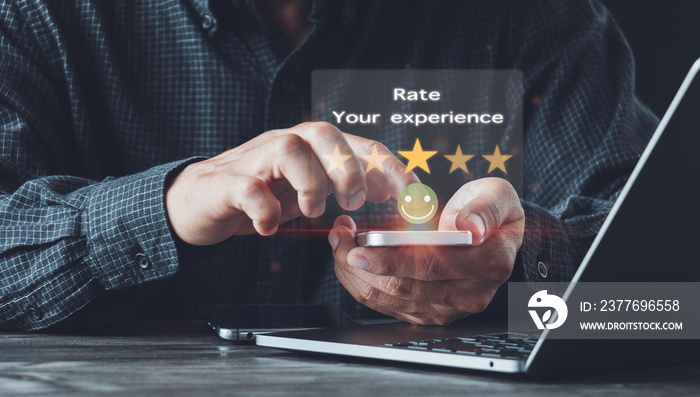 Man using hands holding smartphone Rate your experience,high key and give five-star symbol to increase the rating of product and service Customer service experience and business satisfaction survey.