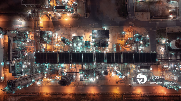 industrial area production plant or refinery crude oil and gas for transportatioon and export, aerial photography at night scene from drone,