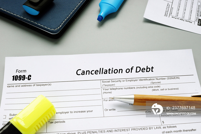 Business concept meaning Form 1099-C Cancellation of Debt with sign on the page.