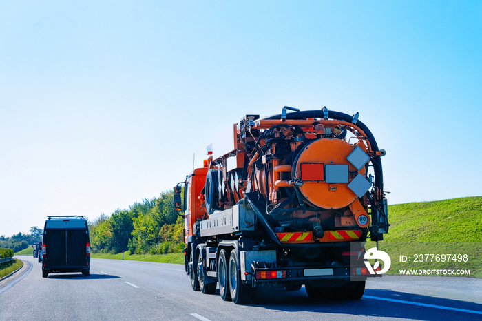 Vacuum waste cistern truck on highway road in Slovenia