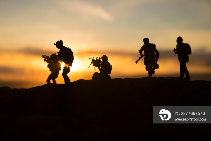 War Concept. Military silhouettes fighting scene on war fog sky background, World War Soldiers Silhouette Below Cloudy Skyline At sunset.