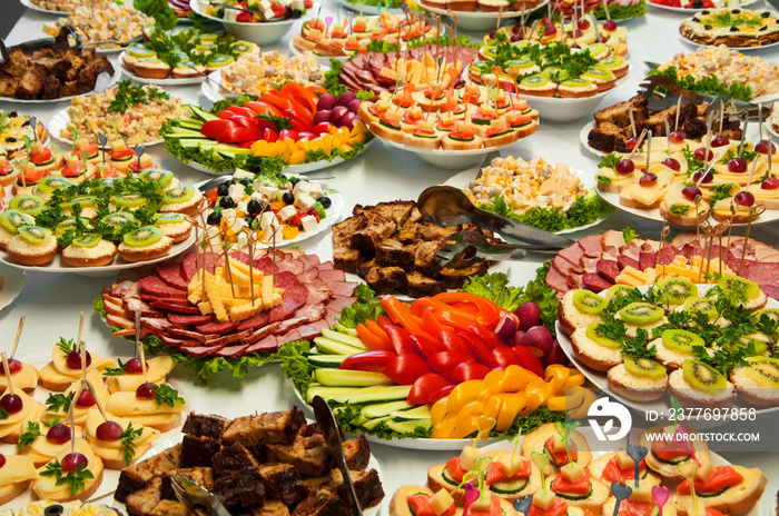 delicious dishes on the festive table. different food on the wedding table. the concept of celebrating an important event. buffet table with sandwiches and cold cuts