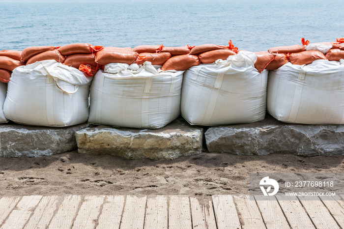 Plastic flood protection sandbags stacked into a temporary wall