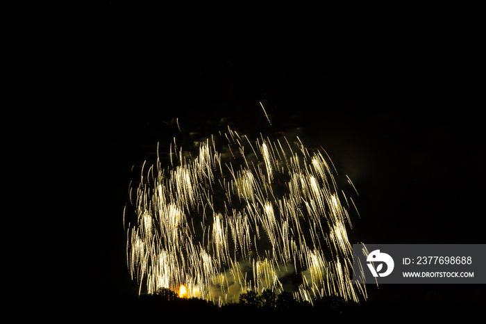 Orange fire rain of international fireworks competition at festival in ostfildern