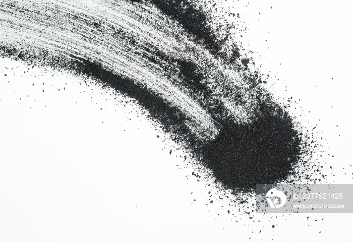 Abstract picture of activated charcoals powder on white background.