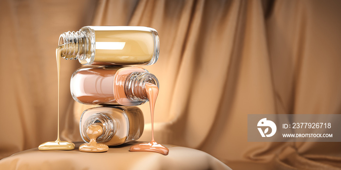 Make up liquid foundation cream cosmetics bottles ion beige velvet  background.