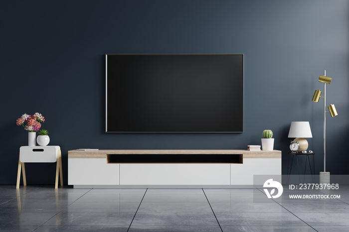 Mockup tv on cabinet in modern empty room with behind the dark blue wall.