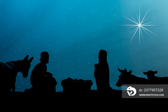 a silhouette of the creche with a stary sky and star of bethlehem