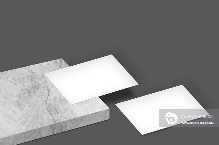 white blank business card mockup on a marble and floor with dark grey background