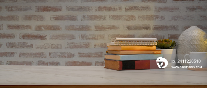 Study table in home office room with books, decorations and copy space on the table