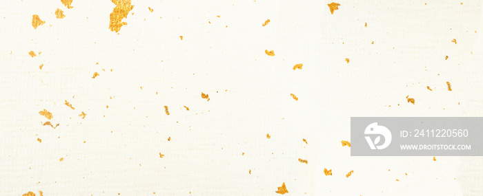 Paper with gold sheet texture as background.