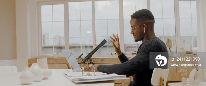 African American male remote working from home, having work confrence video call. Stay home, quarantine remote work