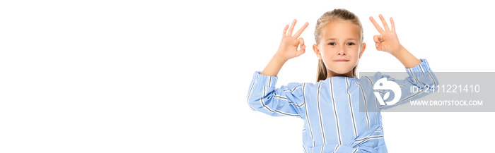 Smiling kid showing okay gesture isolated on white, banner