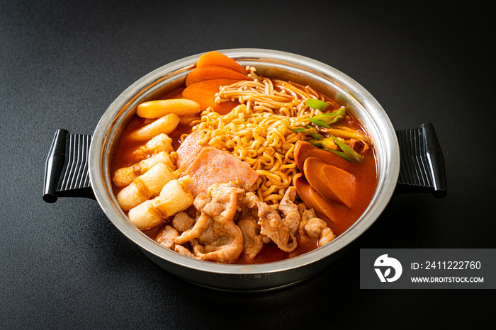 Budae Jjigae or Budaejjigae (Army stew or Army base stew). It is loaded with Kimchi, spam, sausages, ramen noodles and much more