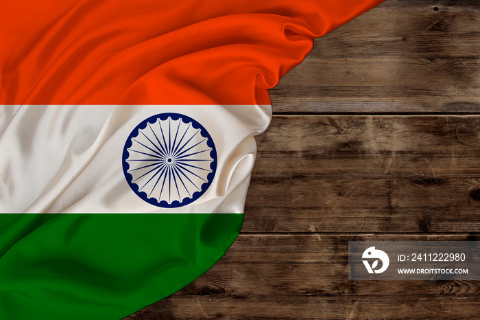 color national flag of modern state of india, beautiful silk, old wood background, concept of tourism, economy, politics, emigration, independence day, copy space, template, horizontal