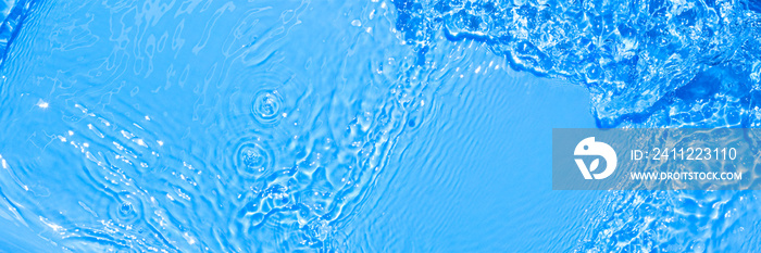 Surface of blue swimming pool water with light reflection. Texture of transparent blue water with ripples and waves in swimming pool. Trendy abstract nature background.