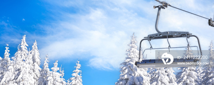 Ski resort, ski lift and snow pine trees