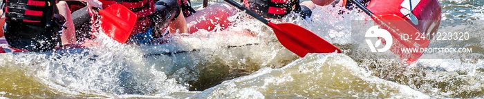 Rafting, kayaking. Extreme sport. Water ecological tourism. Close-up view of oars with splashing water.