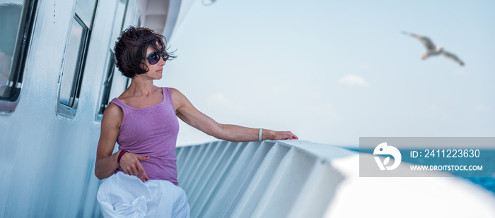 Woman standing on a ship deck