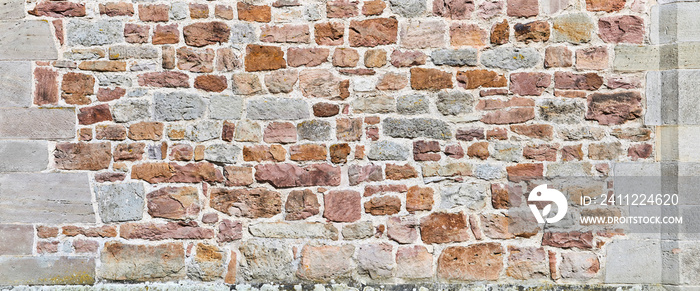 Old un plastered castle wall, close-up.