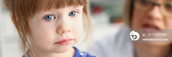 Little child with mother at pediatrician reception