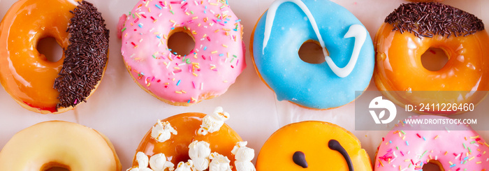 sweet doughnuts on gray stone background