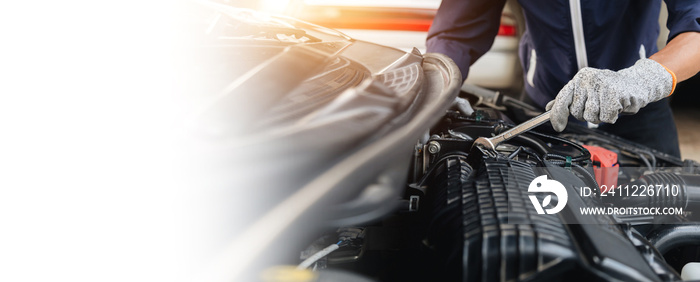 Automobile mechanic repairman hands repairing a car engine automotive workshop with a wrench, car service and maintenance,Repair service.