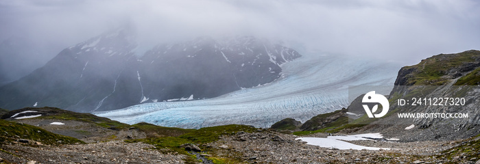 Front detail view of Exit glacier under the clouds