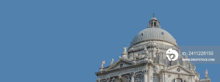 Panoramic banner over Grand Canal with Basilica di Santa Maria della Salute, in Venice historical downtown, Italy, at sunny day, blue sky solid background with copy space