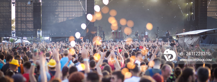 Summer music festival concert crowd