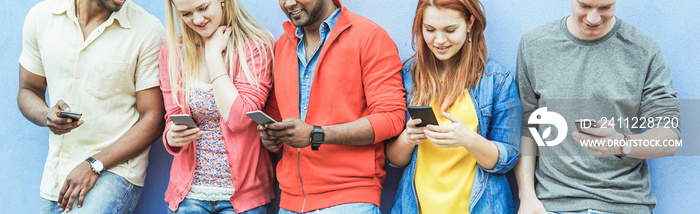 Group of diverse culture friends watching smart mobile phones