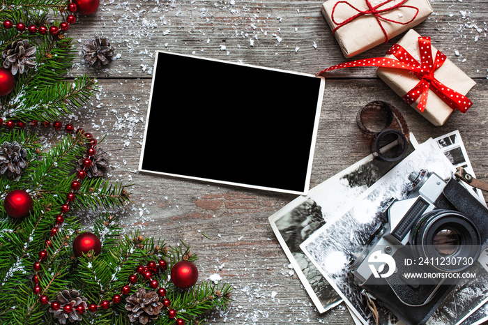 Vintage photo camera on christmas wooden background