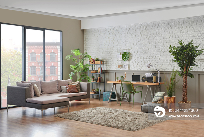 Modern living room grey sofa style with working table computer, lamp, vase of plant carpet and chair