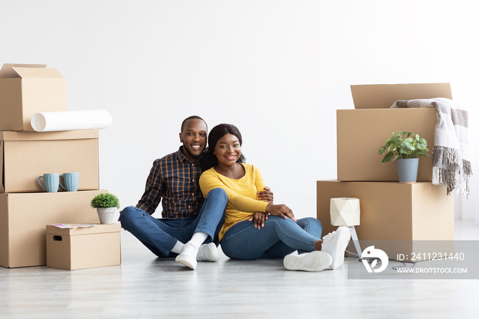 Own House. Happy African American Couple Celebrating Moving To New Flat