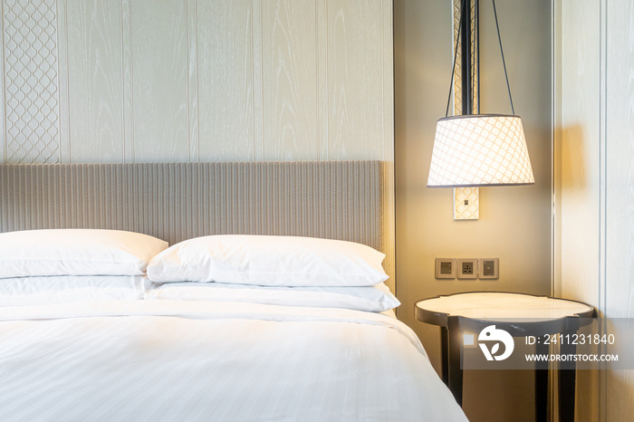 white pillows decoration on bed in bedroom