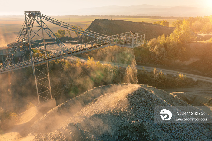 Stone crushing machine. Falling stones in the quarry