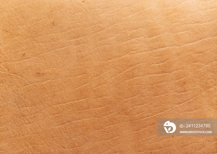 Natural vegetable tanned leather closeup macro full frame texture showing top grain and scratch wear