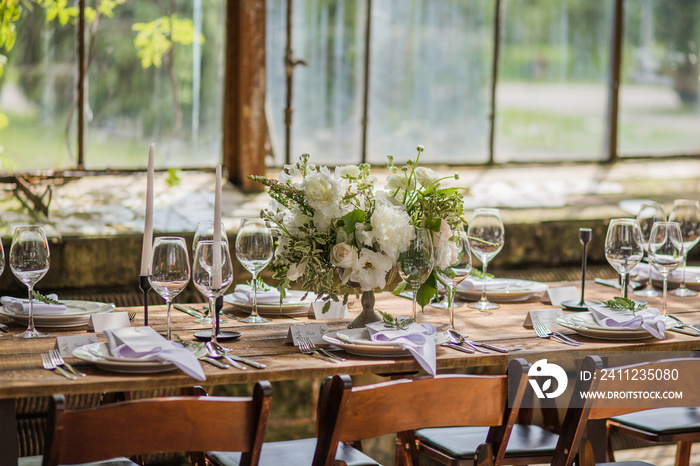 Wedding table decoration in wooden rustic style for a wedding.