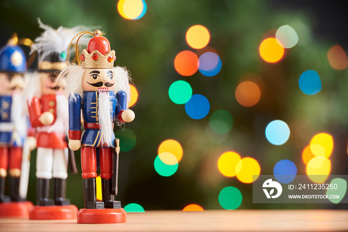 Colorful Christmas nutcrackers with out of focus colored light background