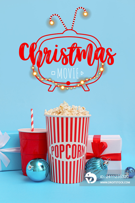 Banner with popcorn, soda drink, Christmas balls and gifts on blue background. Christmas celebration