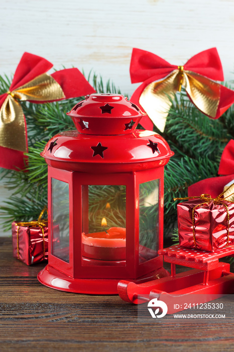 Burning candle lantern with decorations.