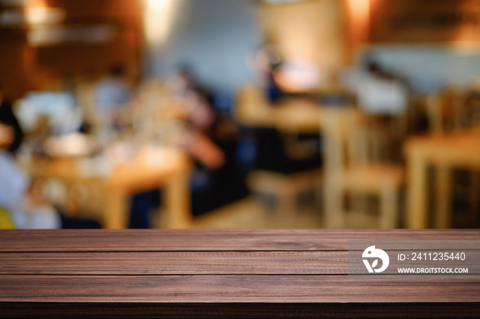 Empty wooden table space platform and blurred resturant or coffee shop background for product displa