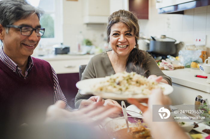 Mother Serving her Family Food