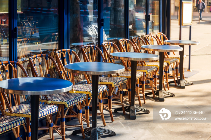 Street view of a coffee terrace with tables and chairs, Paris, France