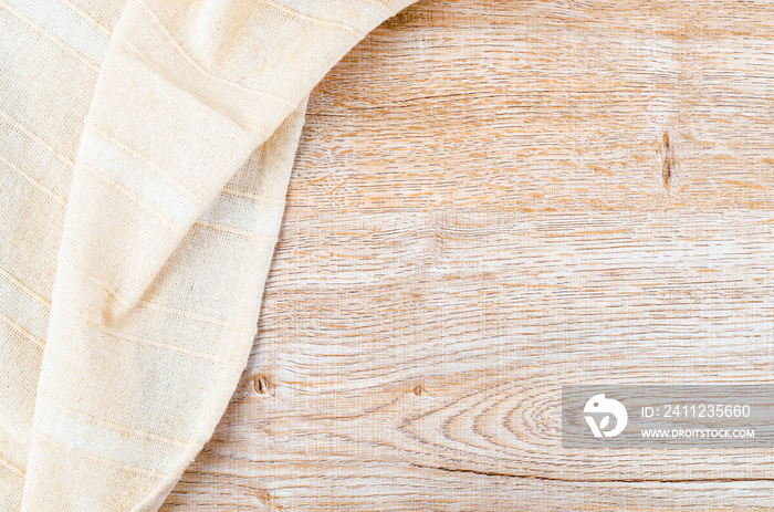 Tablecloth textile on wooden background.